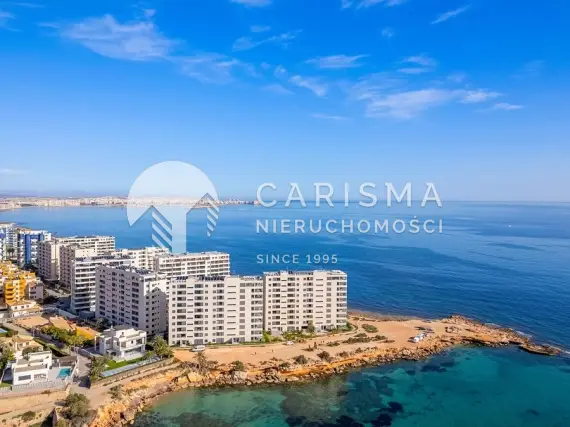 (5) Apartament w pierwszej linii brzegowej w Punta Prima z panoramicznym widokiem na Morze Śródziemne